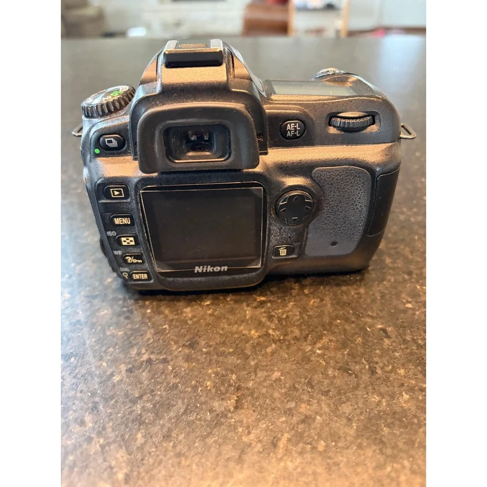 Nikon D50 DSLR camera with accessories charger, strap, cables, manual lens